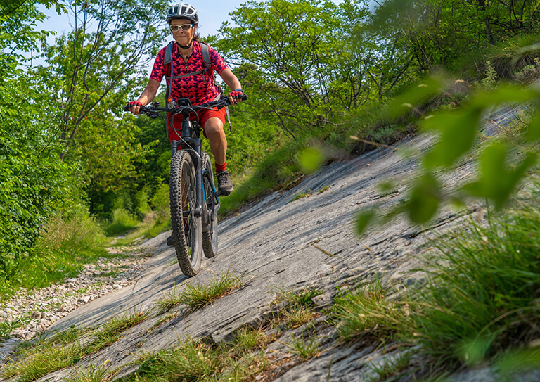 Nice,,Active,Senior,Woman,Riding,Her,Electric,Mountain,Bike,In